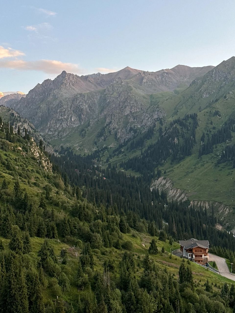 Mountain landscape with forest and retreat lodge