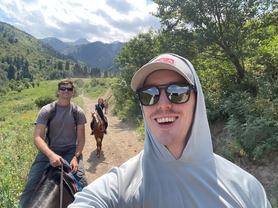 Group of guests with mountain backdrop on the retreat