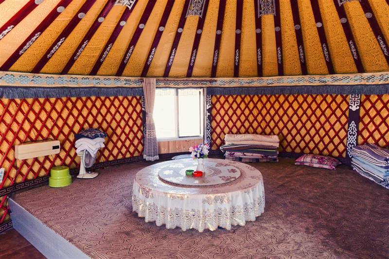 Cozy interior of a traditional yurt with warm natural light