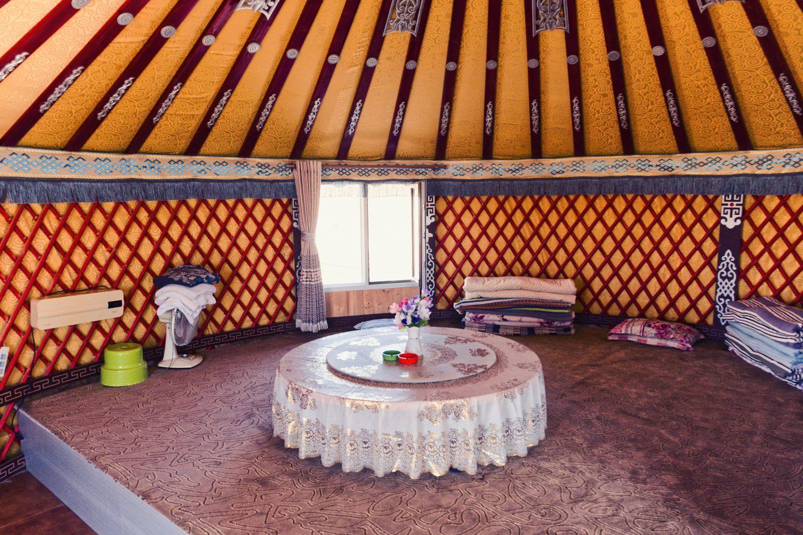 Cozy interior of a traditional yurt with warm natural light